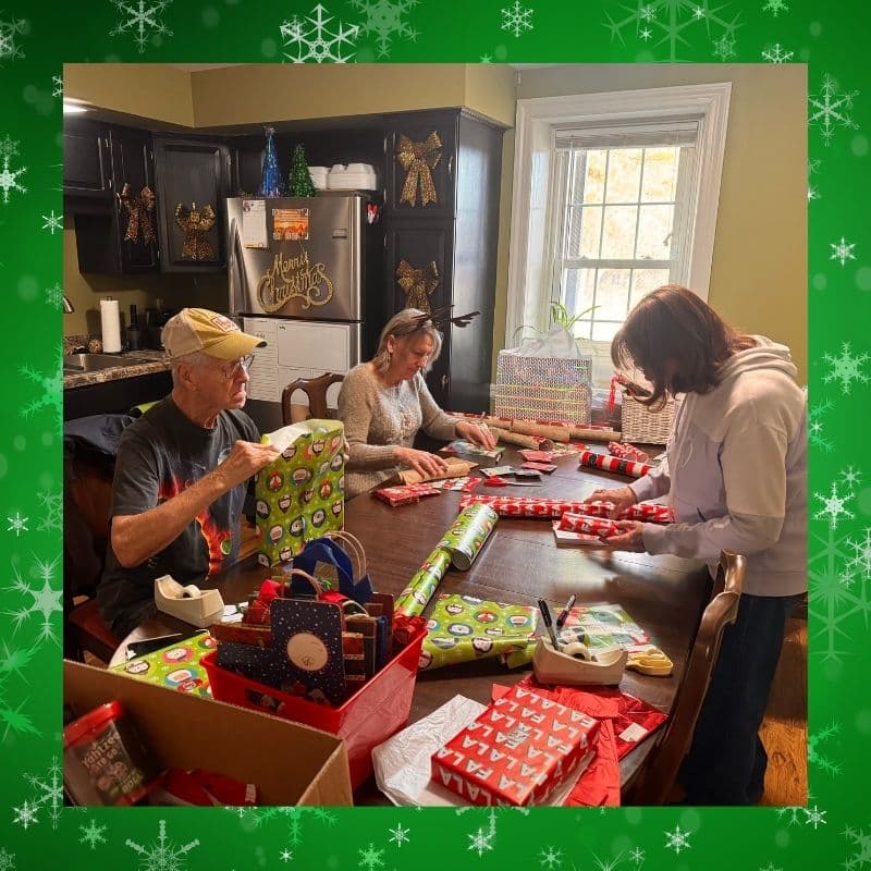 Volunteers wrapping holiday gifts at Hoffman Homes